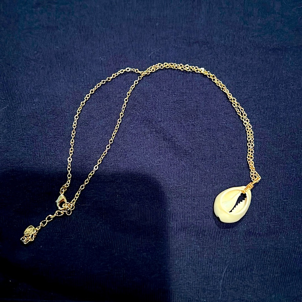 Puka shell necklace with gold